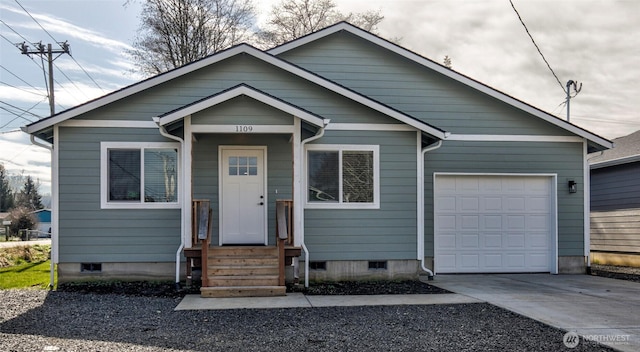 view of front of house featuring crawl space, a garage, and concrete driveway