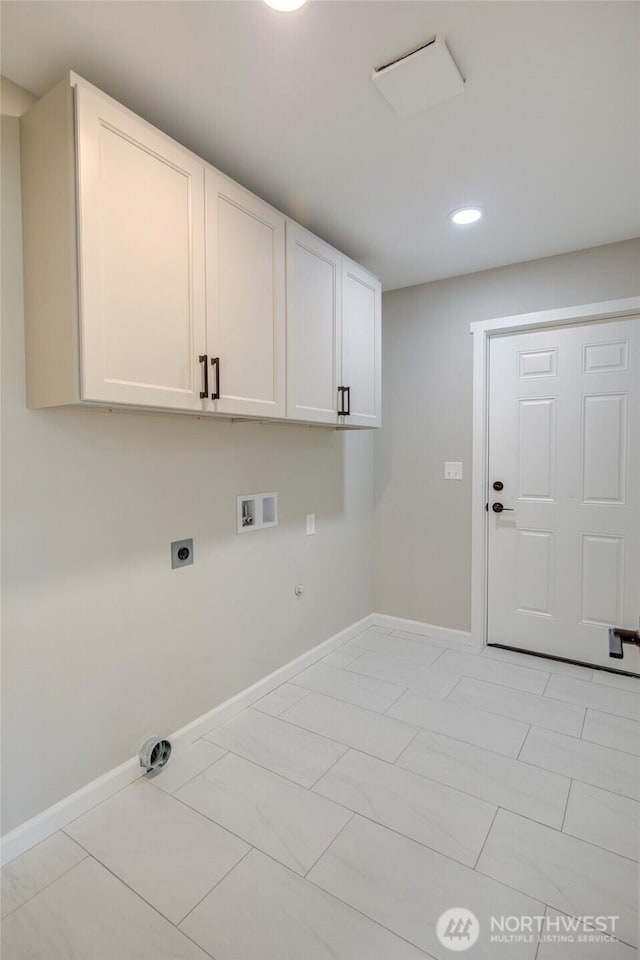 laundry room with cabinet space, baseboards, hookup for a gas dryer, washer hookup, and electric dryer hookup