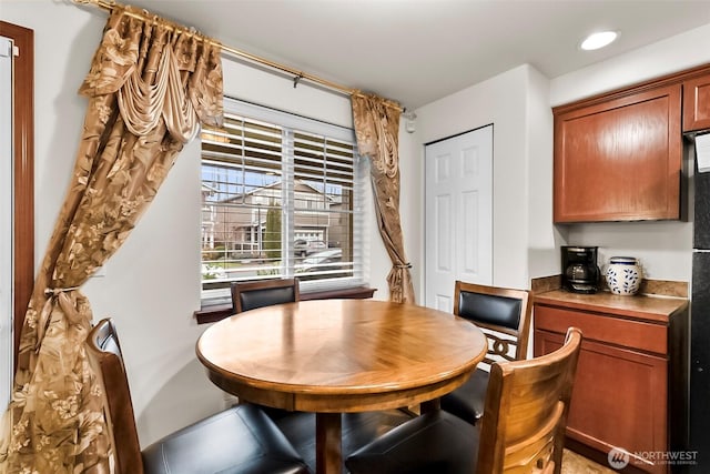 dining space with recessed lighting