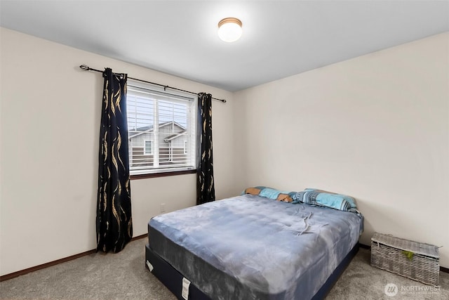 carpeted bedroom with baseboards