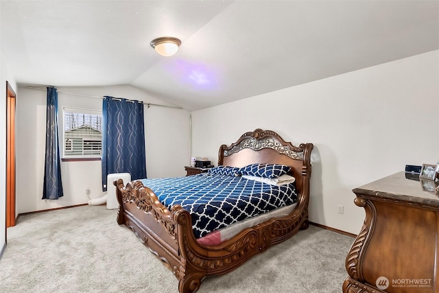 bedroom featuring baseboards, vaulted ceiling, and carpet flooring