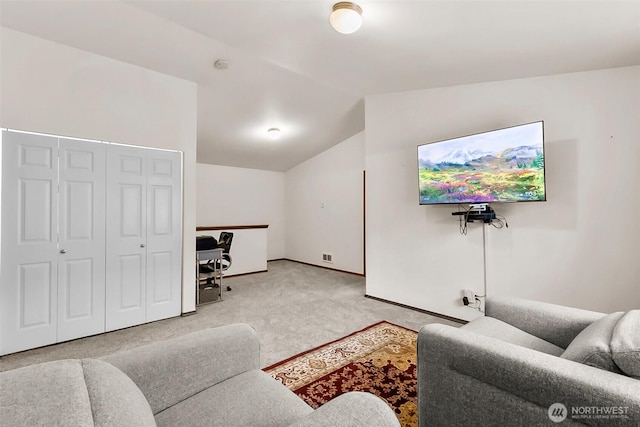 living room with lofted ceiling, baseboards, visible vents, and carpet