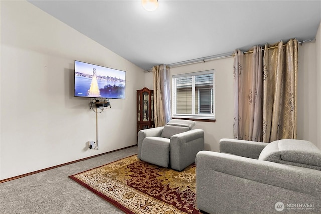 living area with lofted ceiling, carpet floors, and baseboards