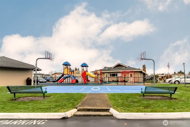 view of basketball court featuring community basketball court, playground community, and a yard