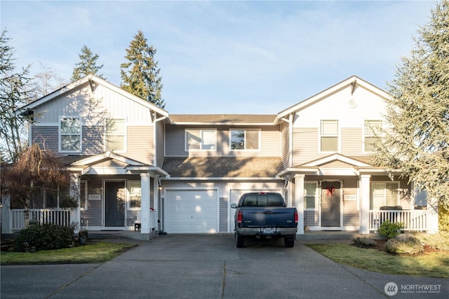 view of front of house with covered porch, driveway, a shingled roof, and an attached garage