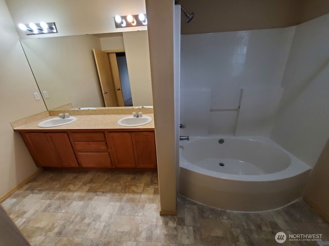 bathroom with a sink and double vanity