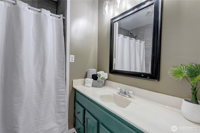 full bath with a shower with shower curtain and vanity