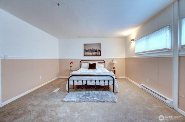 carpeted bedroom with baseboards and baseboard heating