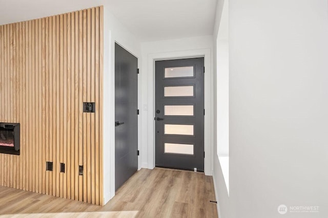 entryway with light wood-style flooring