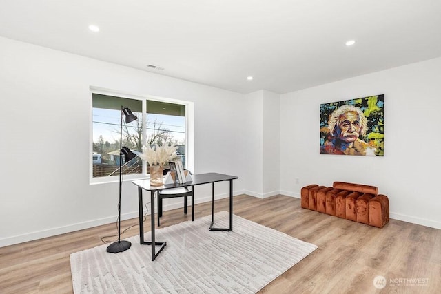 office area with recessed lighting, visible vents, light wood-style flooring, and baseboards