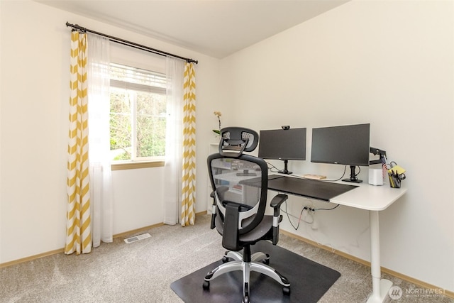 carpeted home office with baseboards and visible vents