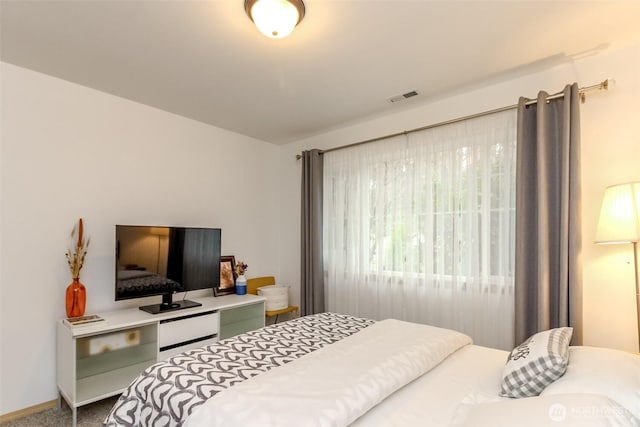 bedroom featuring carpet flooring and visible vents