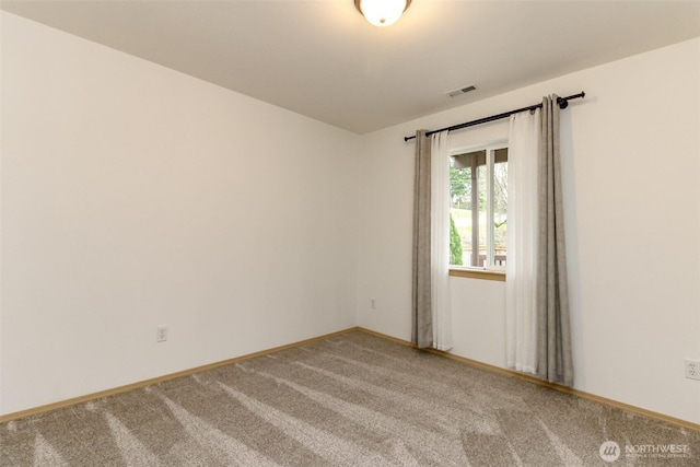 empty room with light carpet, baseboards, and visible vents