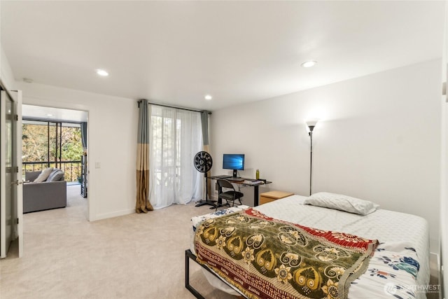 bedroom featuring light carpet, recessed lighting, and multiple windows