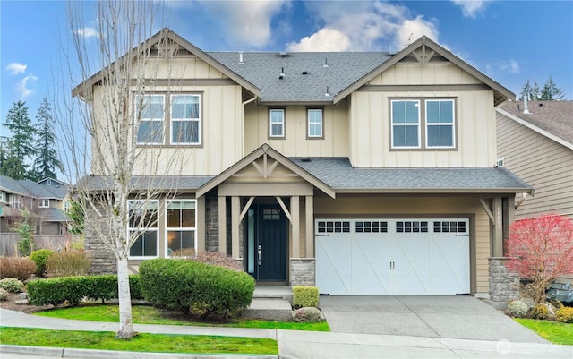 craftsman inspired home with board and batten siding, stone siding, and a shingled roof