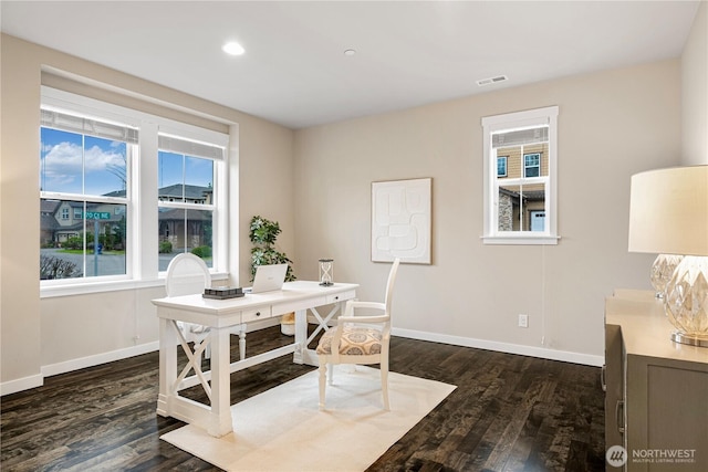 office featuring dark wood-style floors, visible vents, and baseboards