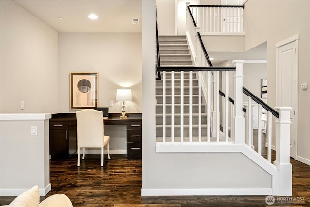 stairs featuring visible vents, baseboards, wood finished floors, and recessed lighting