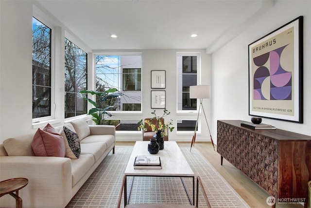 living room with wood finished floors and recessed lighting