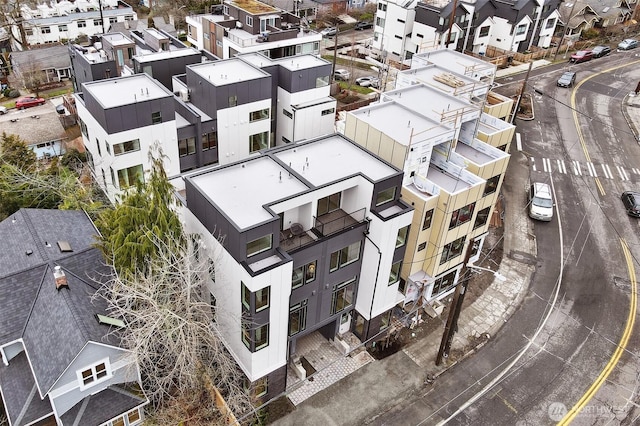 birds eye view of property with a residential view