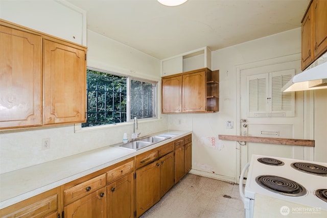 kitchen featuring open shelves, electric range, a sink, light countertops, and light floors