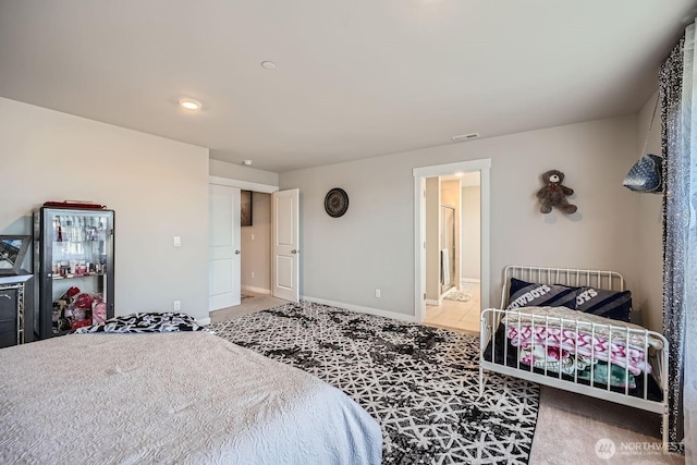 bedroom featuring light colored carpet, visible vents, and baseboards