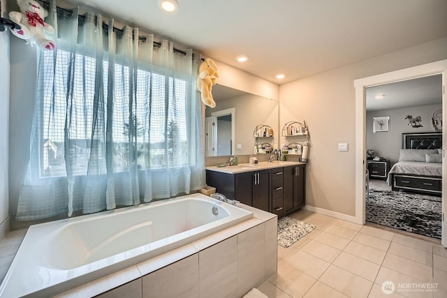 ensuite bathroom featuring ensuite bath, tile patterned floors, vanity, a bath, and recessed lighting