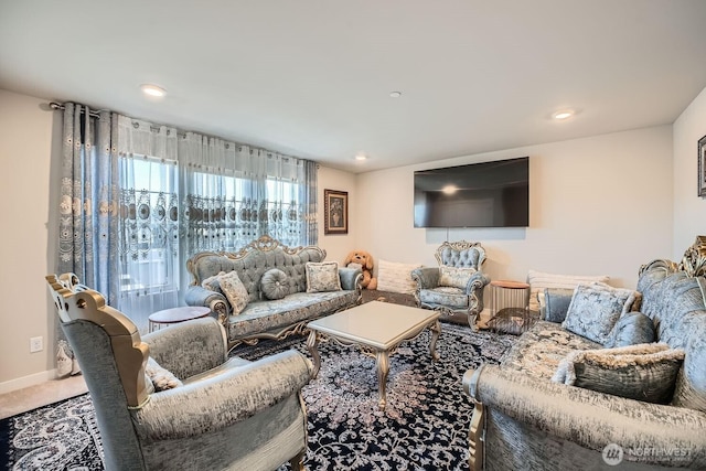 living area featuring carpet floors, baseboards, and recessed lighting