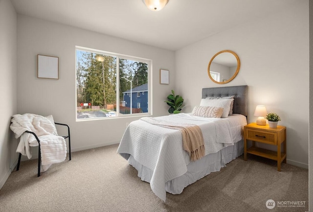 carpeted bedroom with baseboards