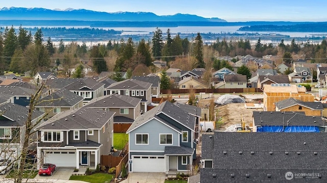 aerial view featuring a mountain view and a residential view