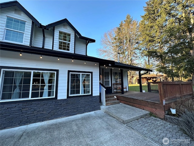 exterior space featuring a wooden deck