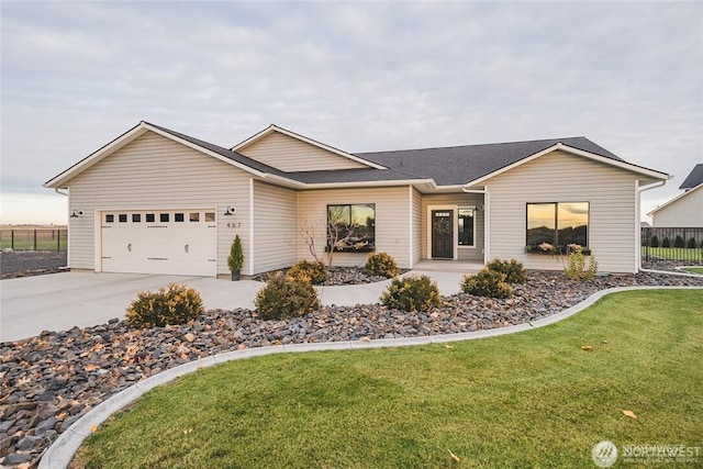 single story home featuring an attached garage, fence, concrete driveway, and a front yard