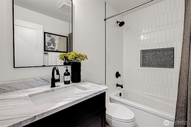 bathroom with shower / washtub combination, visible vents, vanity, and toilet