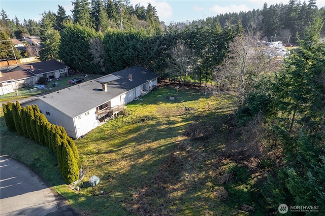 aerial view with a wooded view