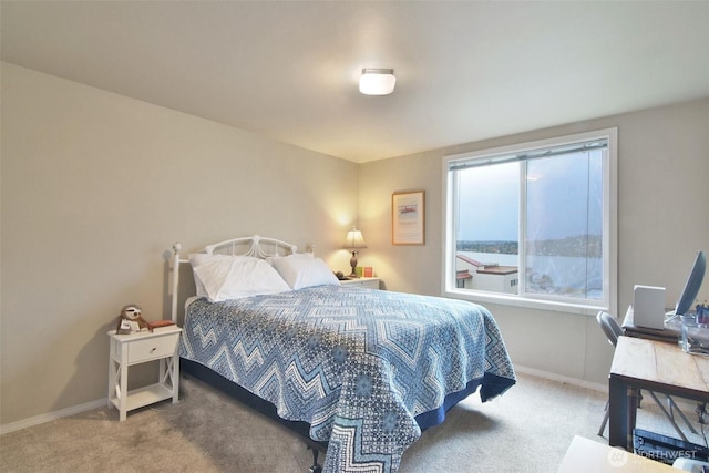 carpeted bedroom with baseboards