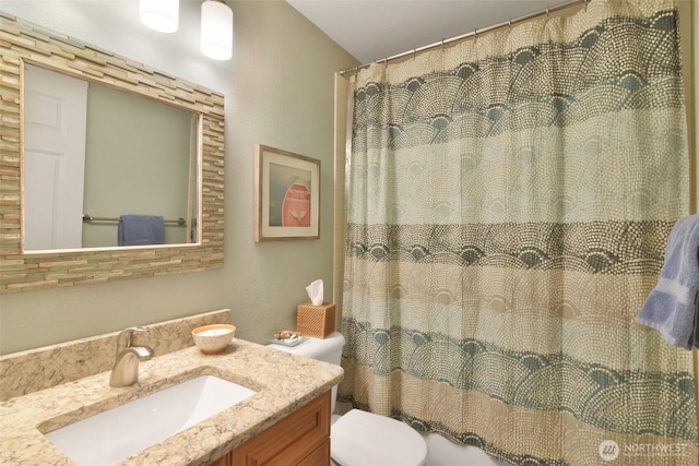 bathroom with toilet and vanity