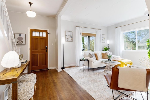 entryway with baseboards and hardwood / wood-style flooring