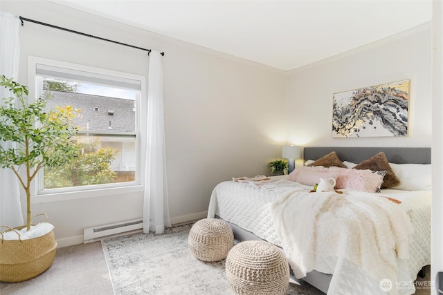 bedroom with baseboards, multiple windows, baseboard heating, and carpet