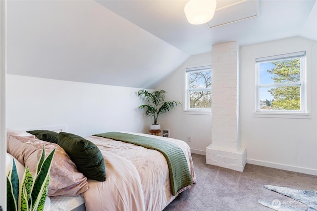 carpeted bedroom with baseboards and lofted ceiling