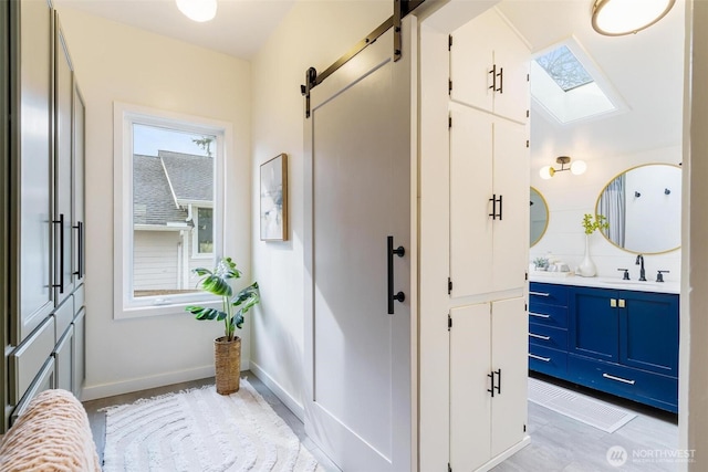 interior space with baseboards and vanity