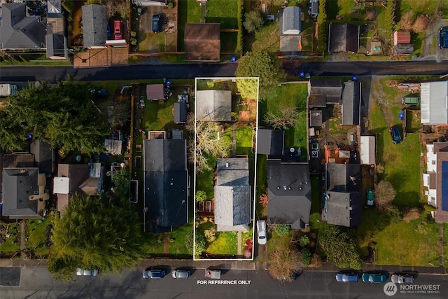 birds eye view of property with a residential view