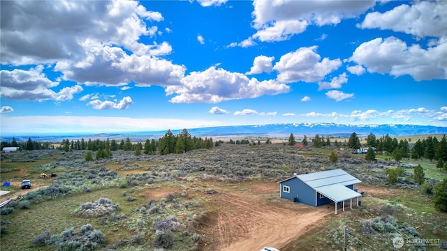 drone / aerial view featuring a mountain view