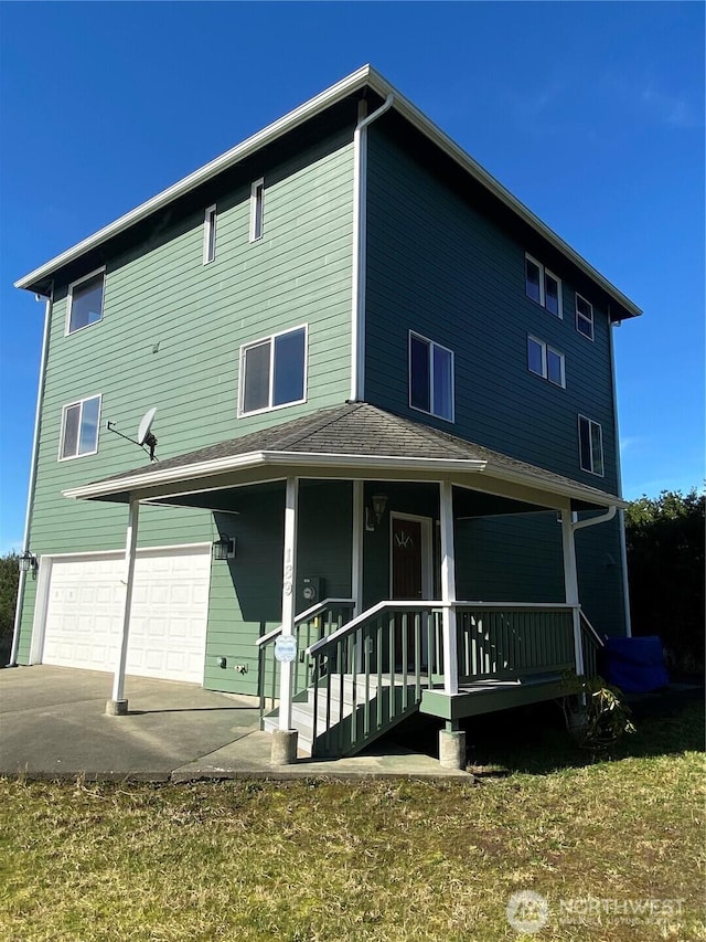 view of front of house with covered porch and an attached garage