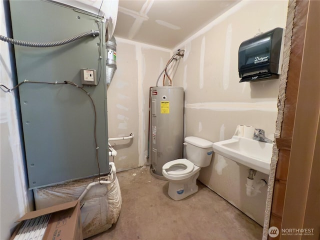 bathroom featuring toilet, unfinished concrete floors, and electric water heater