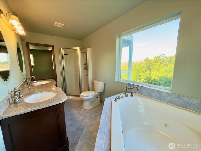 full bathroom featuring visible vents, a sink, a jetted tub, and a shower stall