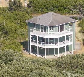 189 Sand Dune Ave SW, Ocean Shores, WA 98569 - back of property with a wooded view