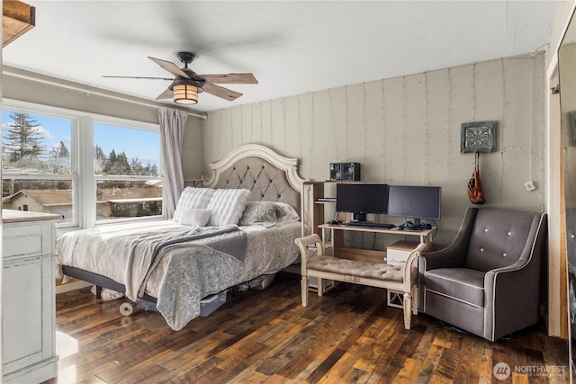 bedroom featuring ceiling fan and dark wood-style flooring