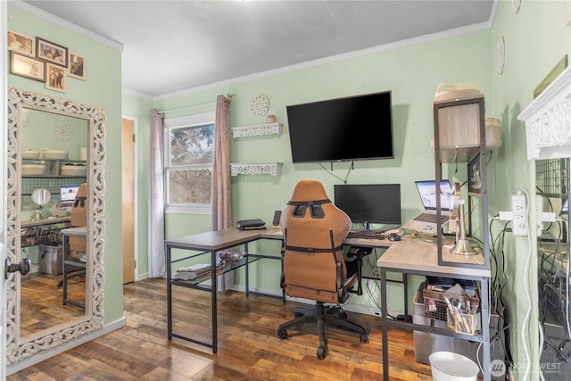 home office featuring ornamental molding, baseboards, and wood finished floors