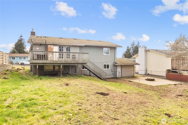 rear view of house with stairway, a patio area, fence, a fire pit, and a wooden deck