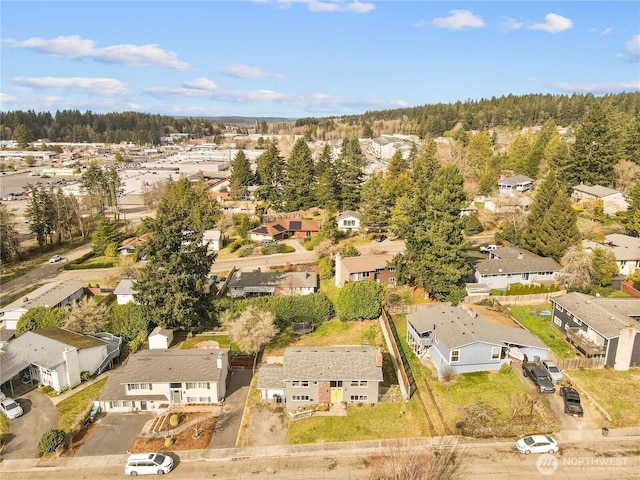 bird's eye view with a forest view and a residential view