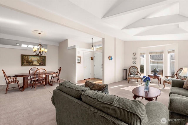 living room featuring light carpet, lofted ceiling, and an inviting chandelier